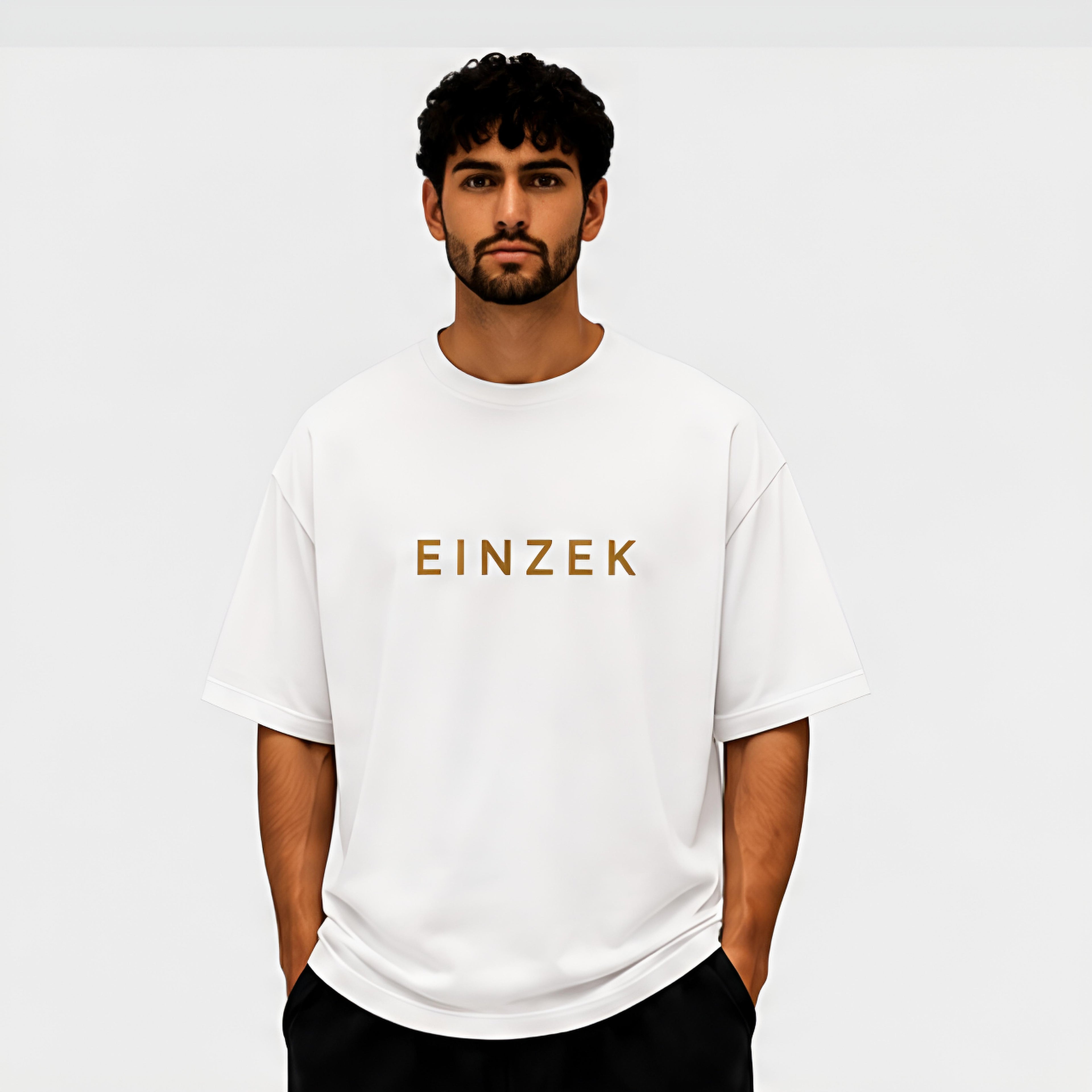Essential Oversized Tee - Front view, EINZEK gold wordmark on white